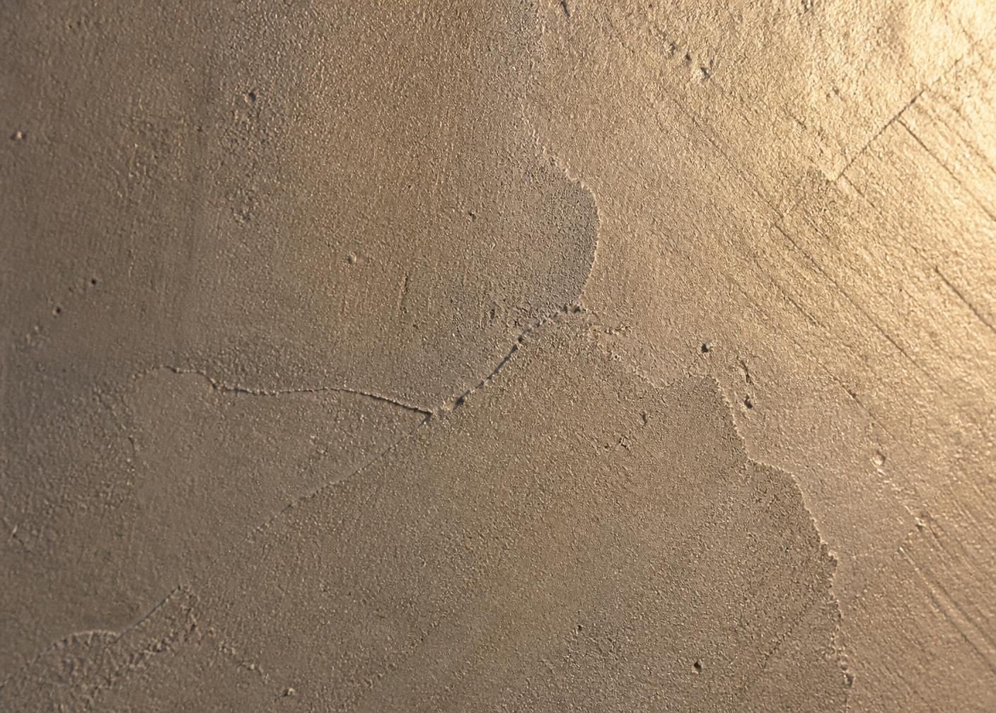 Dettaglio macro di superficie in microcemento spatolato a mano